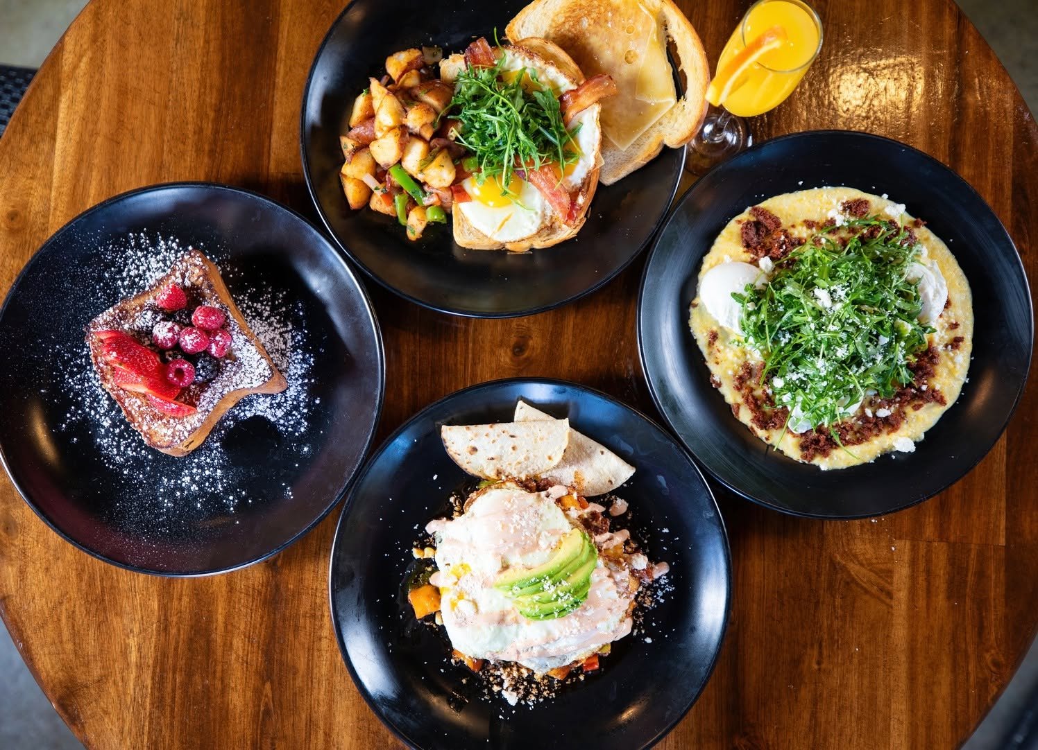 Weekend brunch spread — eggs benedict hash, brioche French toast, polenta and chorizo, chilaquiles