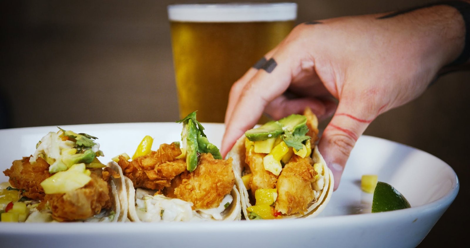 Fish tacos with mango salsa and avocado