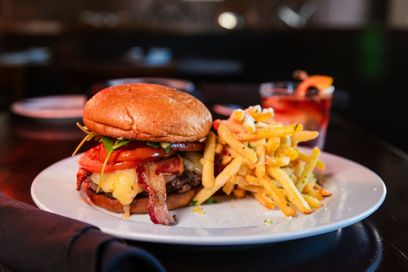 Havarti burger with bacon, roasted tomato and parmesan-truffle fries