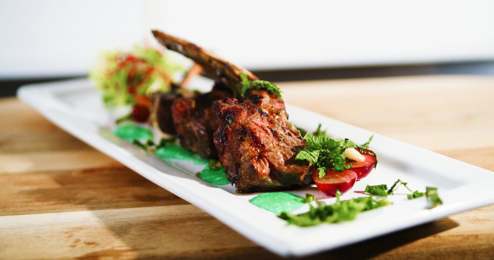 Grilled lamb lollipops with apple mint relish